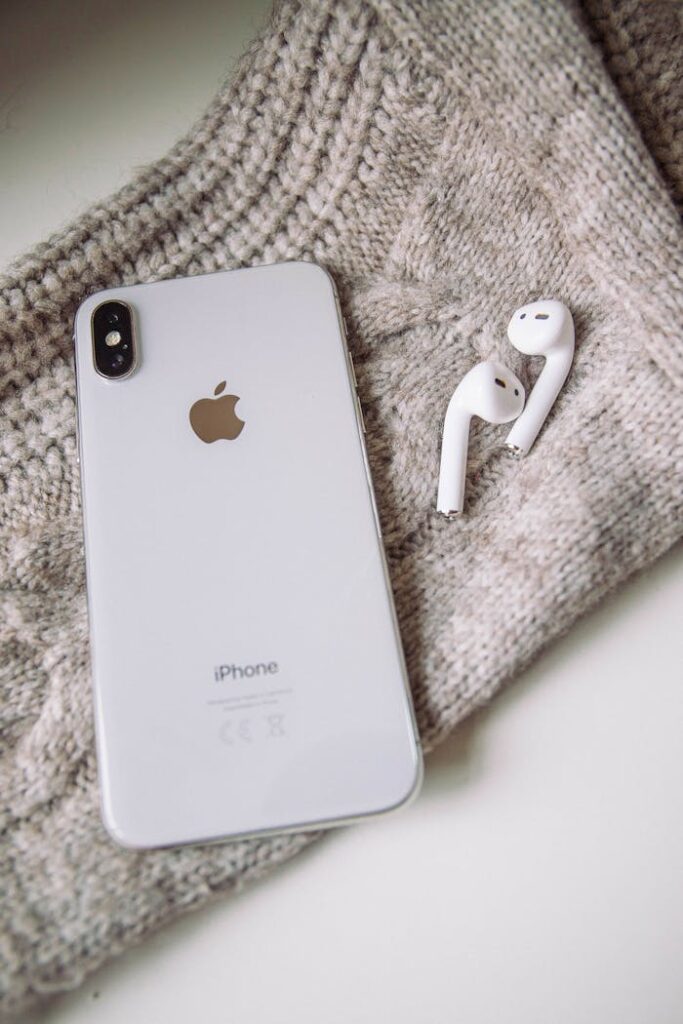 White Apple Products on Gray Textile