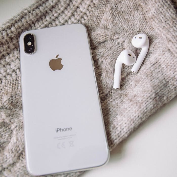 White Apple Products on Gray Textile